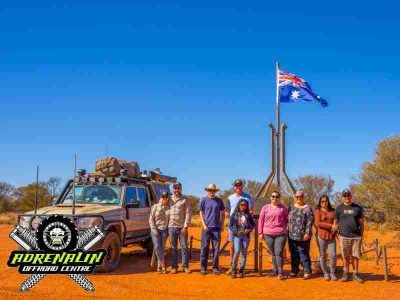 people-near-the-flag-pole-on-a-4x4-tag-along-tour-in-Australia-by-Adrenaline-Offroad-Centre